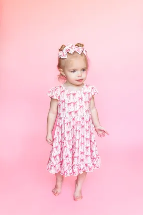 BOW CUTE DREAM RUFFLE DRESS